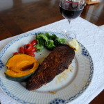 Blackened fish at table